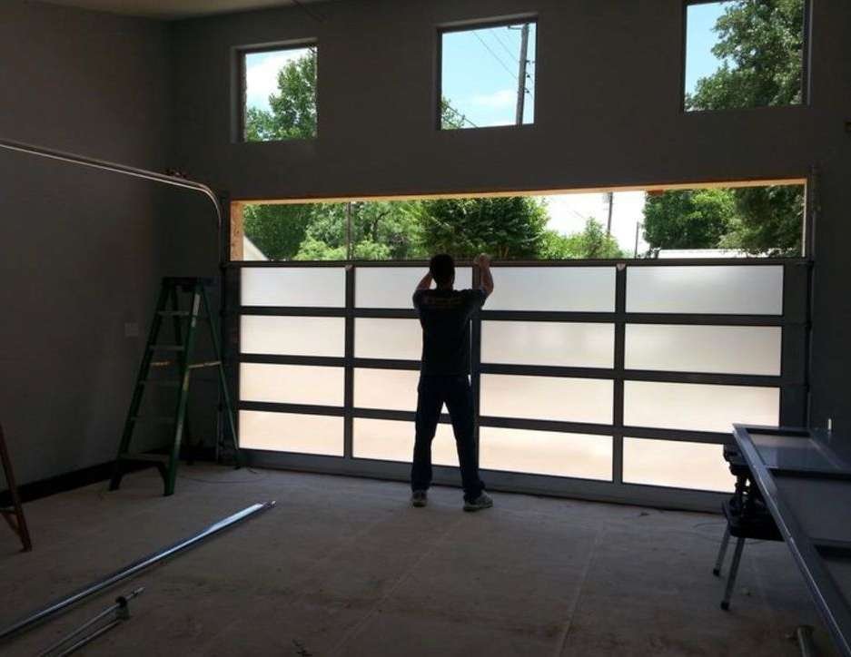 It depicts the installation services and expert garage door repair by a professional.